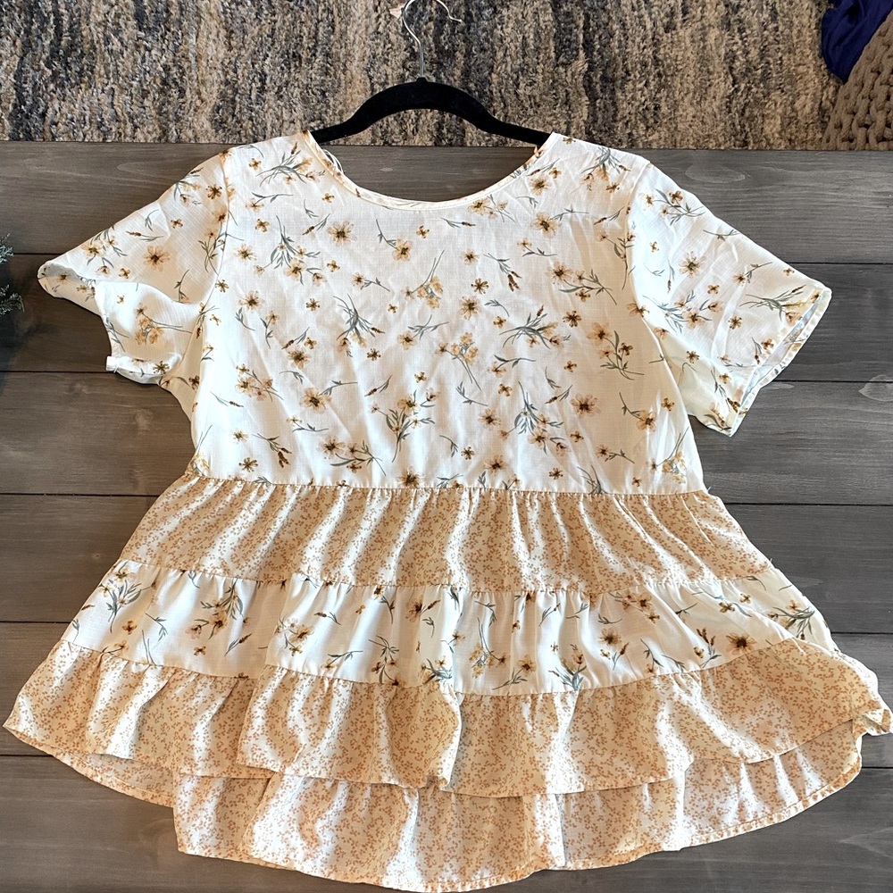 Cute blouse! Dress it up with slacks, jeans or a comfy classic with leggings